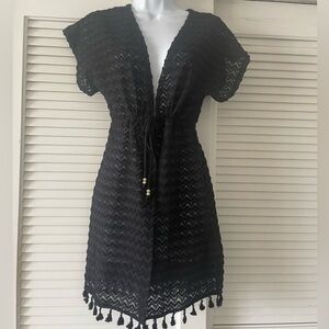 Bathing suit cover up. Drawstring and round tassels.